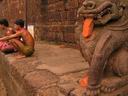 Two boys sit outside one of Bhubaneshwars temples.